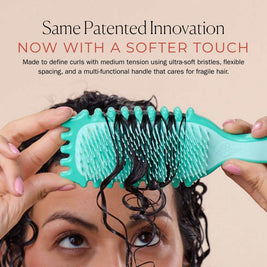 Bounce Curl Slick-Dense Define EdgeLift brush with medium-density TPEE bristles and recycled plastic handle for gentle curl definition on delicate, color-treated hair
